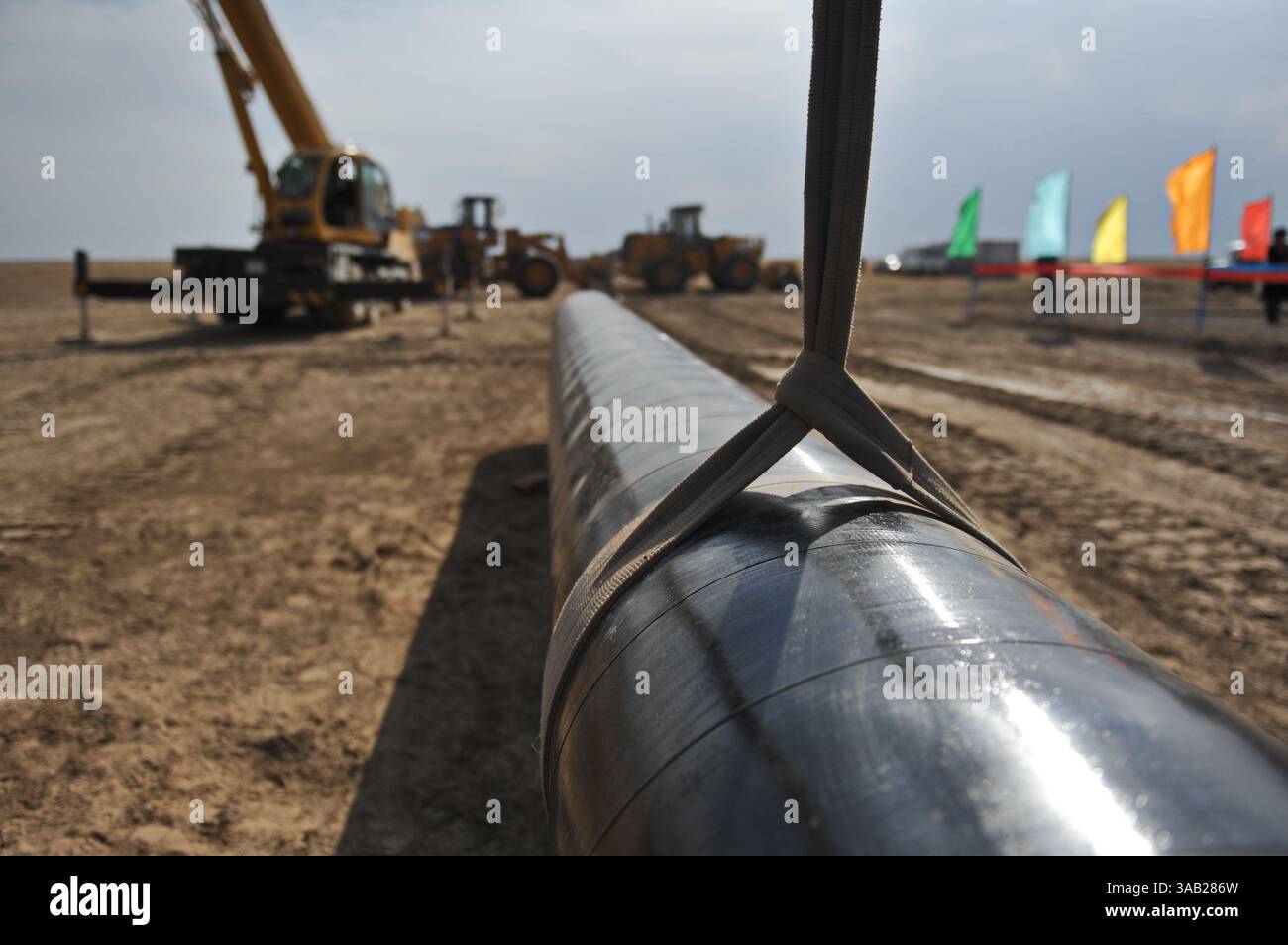 Excavator digs a trench for the construction of a gas pipeline Stock ...