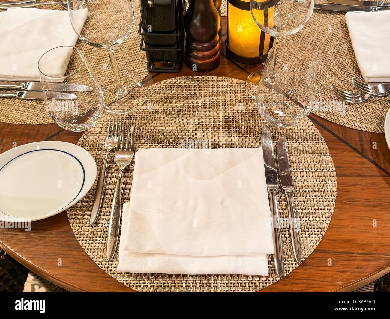 Rustic table setting with cutlery in a restaurant - Smartphone Captured Stock Image