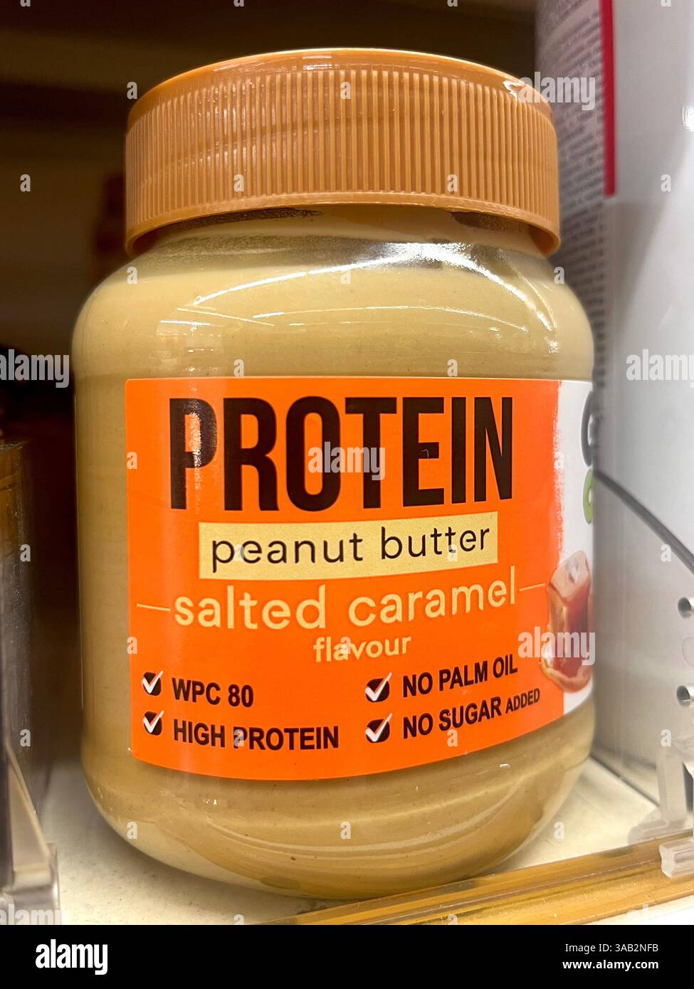 Protein, peanut butter, jar, salted caramel, flavour, no palm oil, supermarket, shopping, consumerism, high protein peanut butter, protein enriched - Smartphone Captured Stock Image