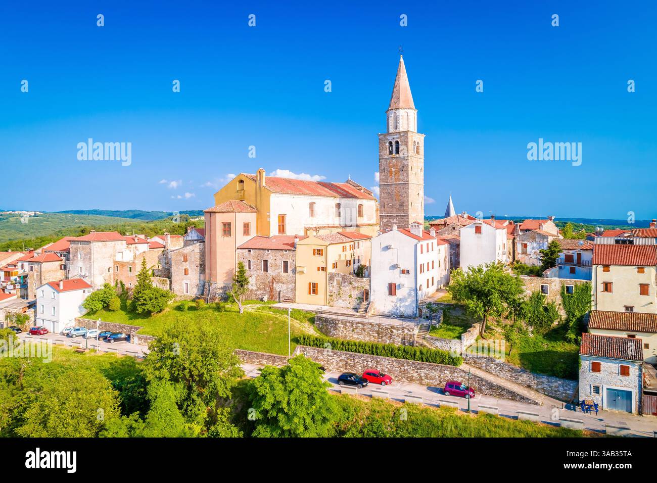 Old stone town of Buje on green hill panoramic view, town in Istria