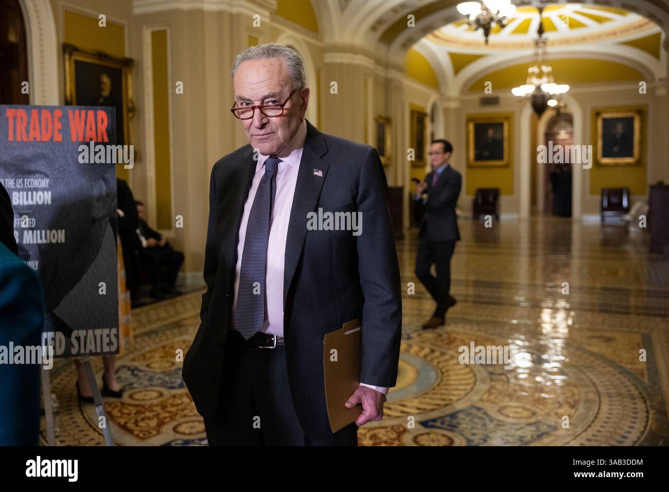 Senate Minority Leader Chuck Schumer (D-N.Y.) looks on during a press ...