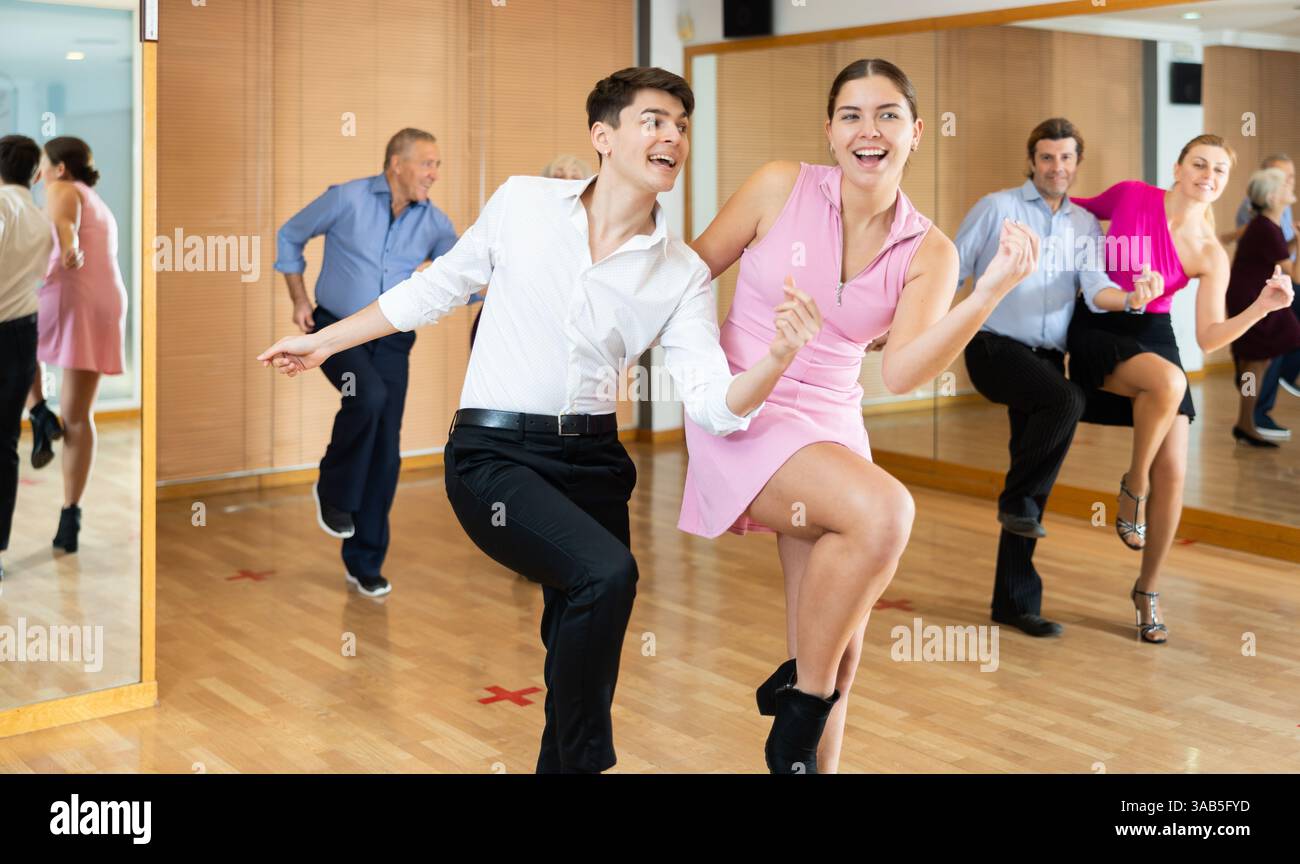 Young pair practicing Latino dance in dance studio Stock Photo