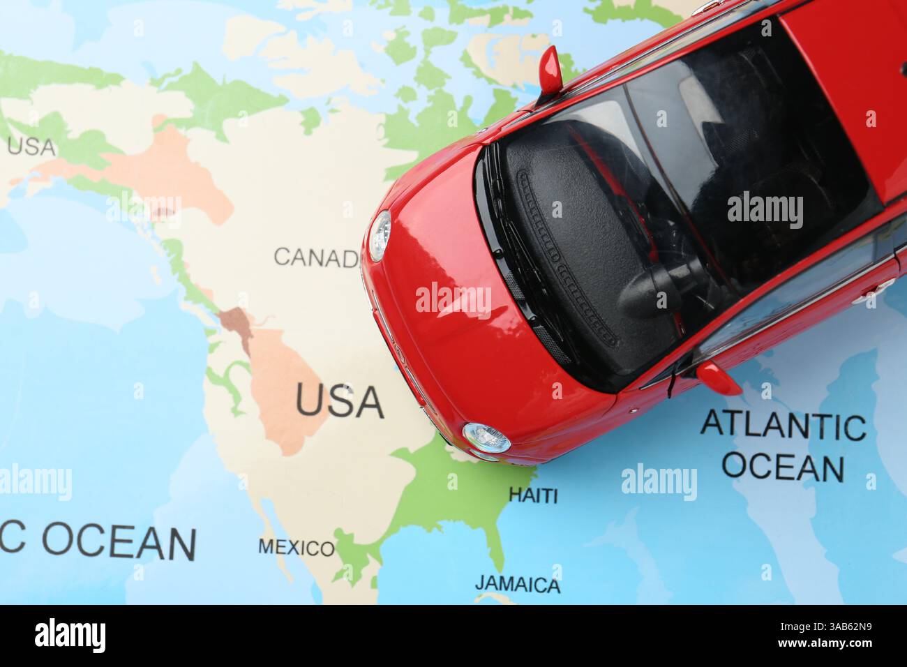 Road trip concept. Car model on world map, top view Stock Photo - Alamy