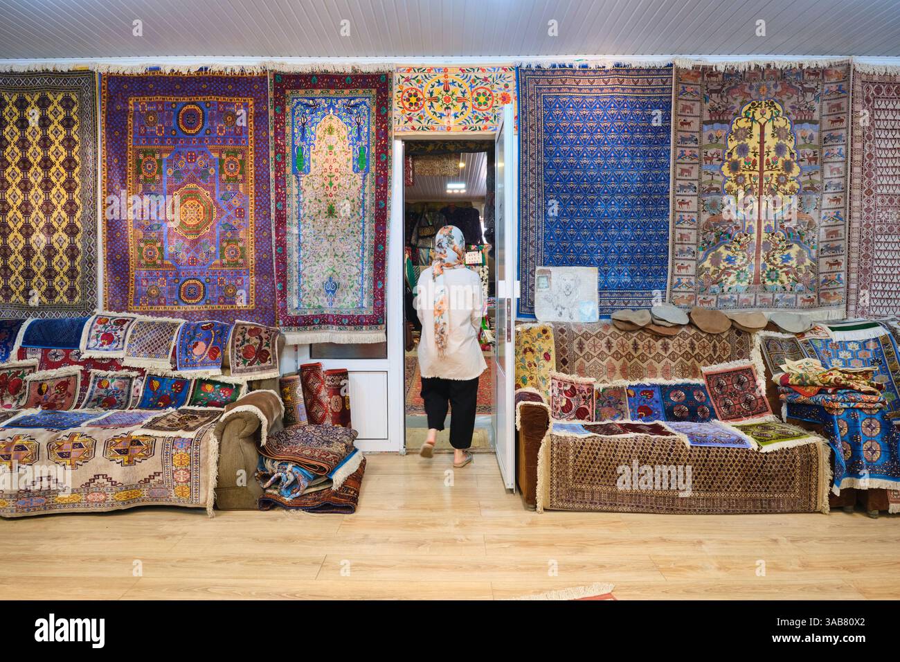 A room with many rugs available on display. In the sales showroom at ...