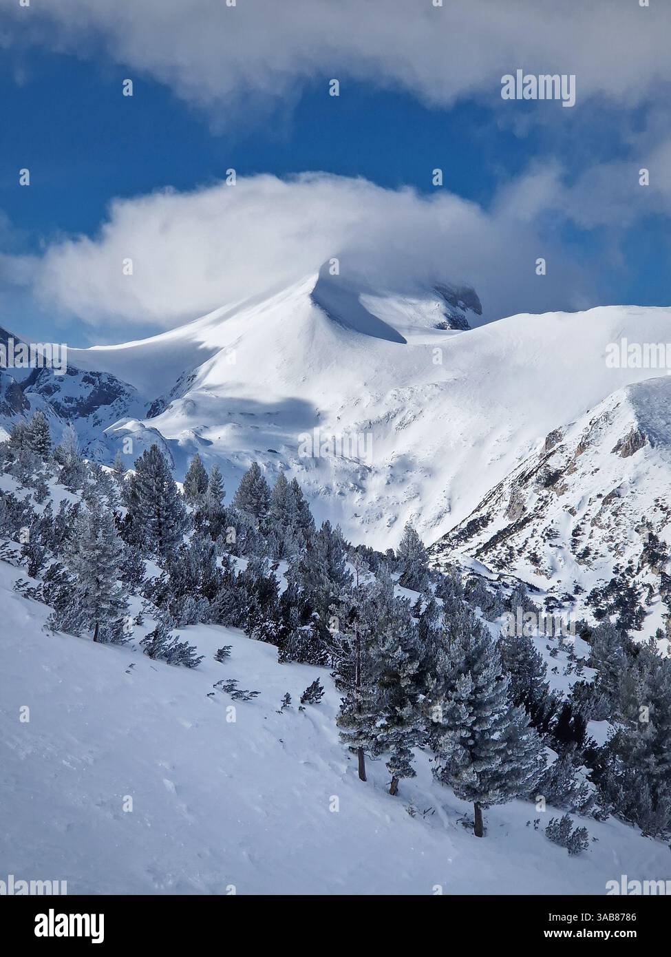 Beautiful Pirin mountains peaks covered with snow. Winter view at Bansko ski resort in Bulgaria - Smartphone Captured Stock Image