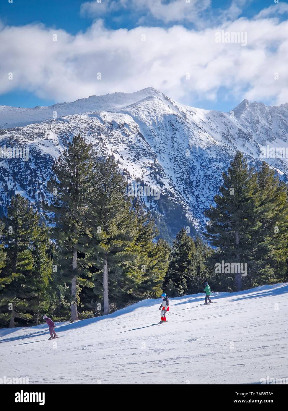 Winter season at Bansko ski resort in Bulgaria with a view to the skiers having fun on the slope - Smartphone Captured Stock Image