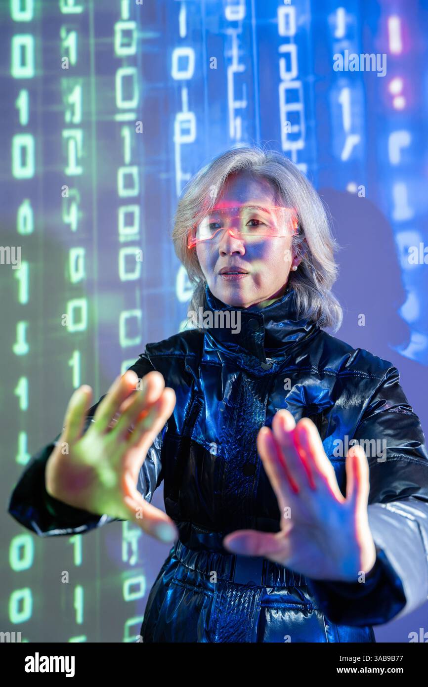 An elderly Asian woman engages with the metaverse using virtual reality ...
