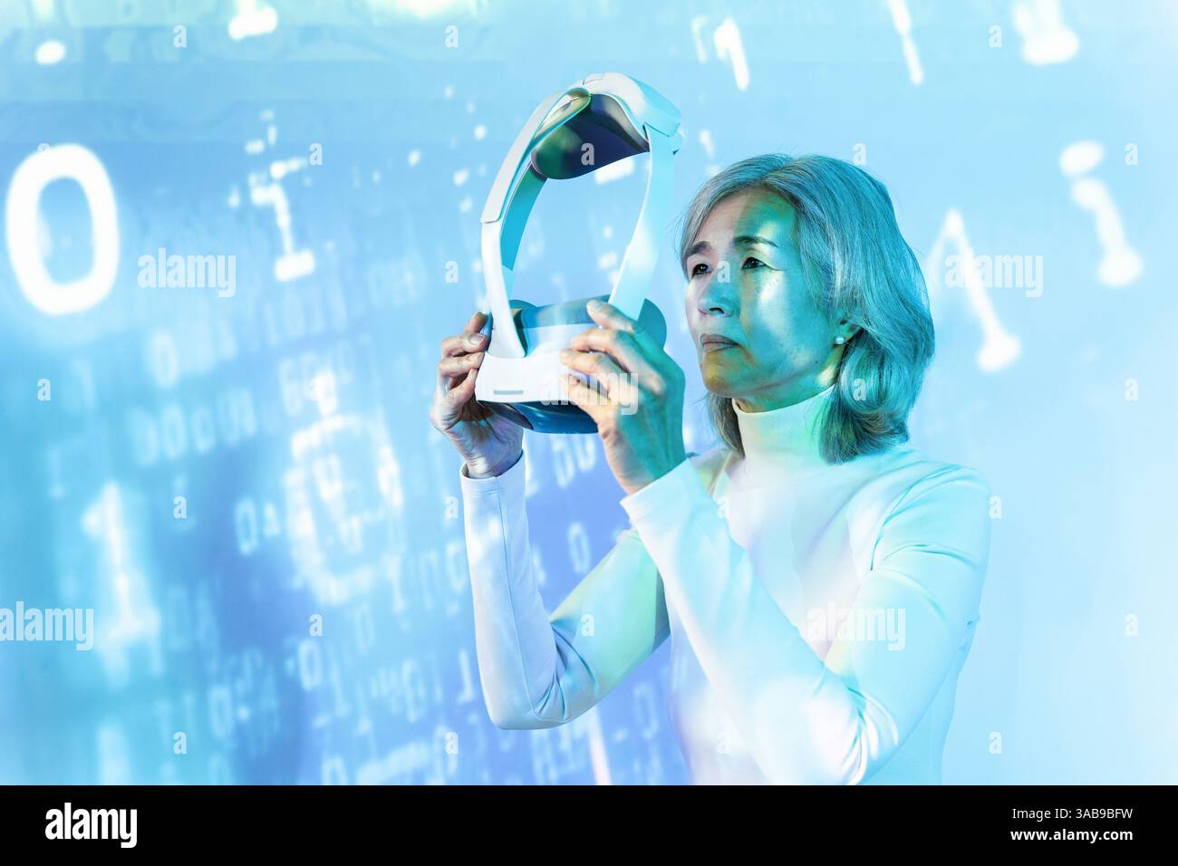 An elderly Asian woman immerses herself in the metaverse using a VR headset. The digital background symbolizes technology and futuristic exploration, Stock Photo