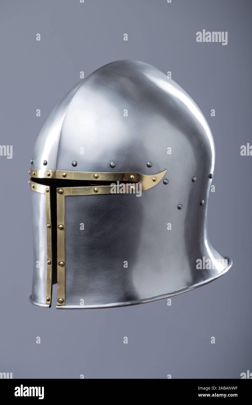 Silver Medieval Barbute Helmet with Brass Trim. This image shows a ...