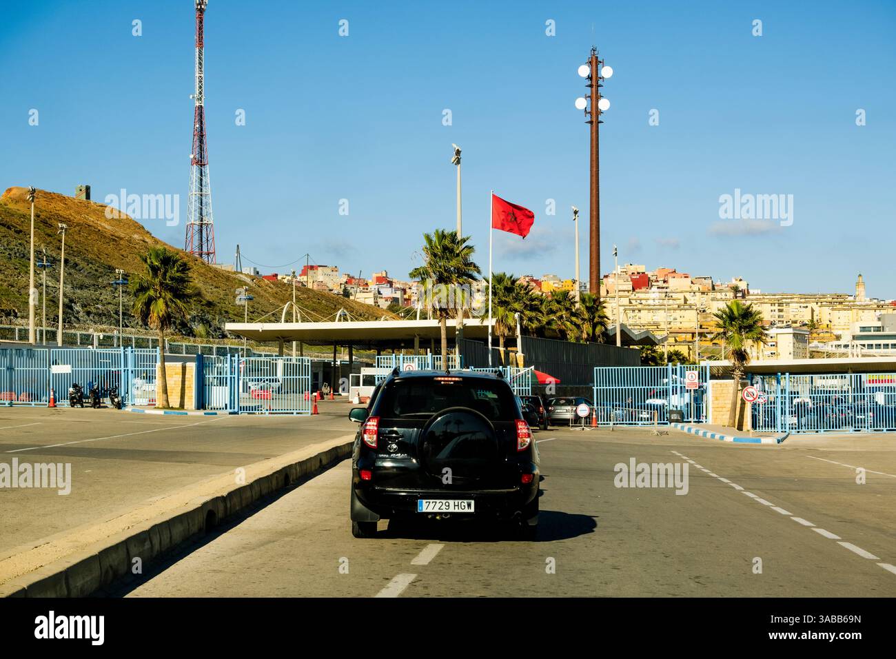 Fnideq, Morocco - December 26 2023: car passing country border between Morocco and Spain Stock Photo