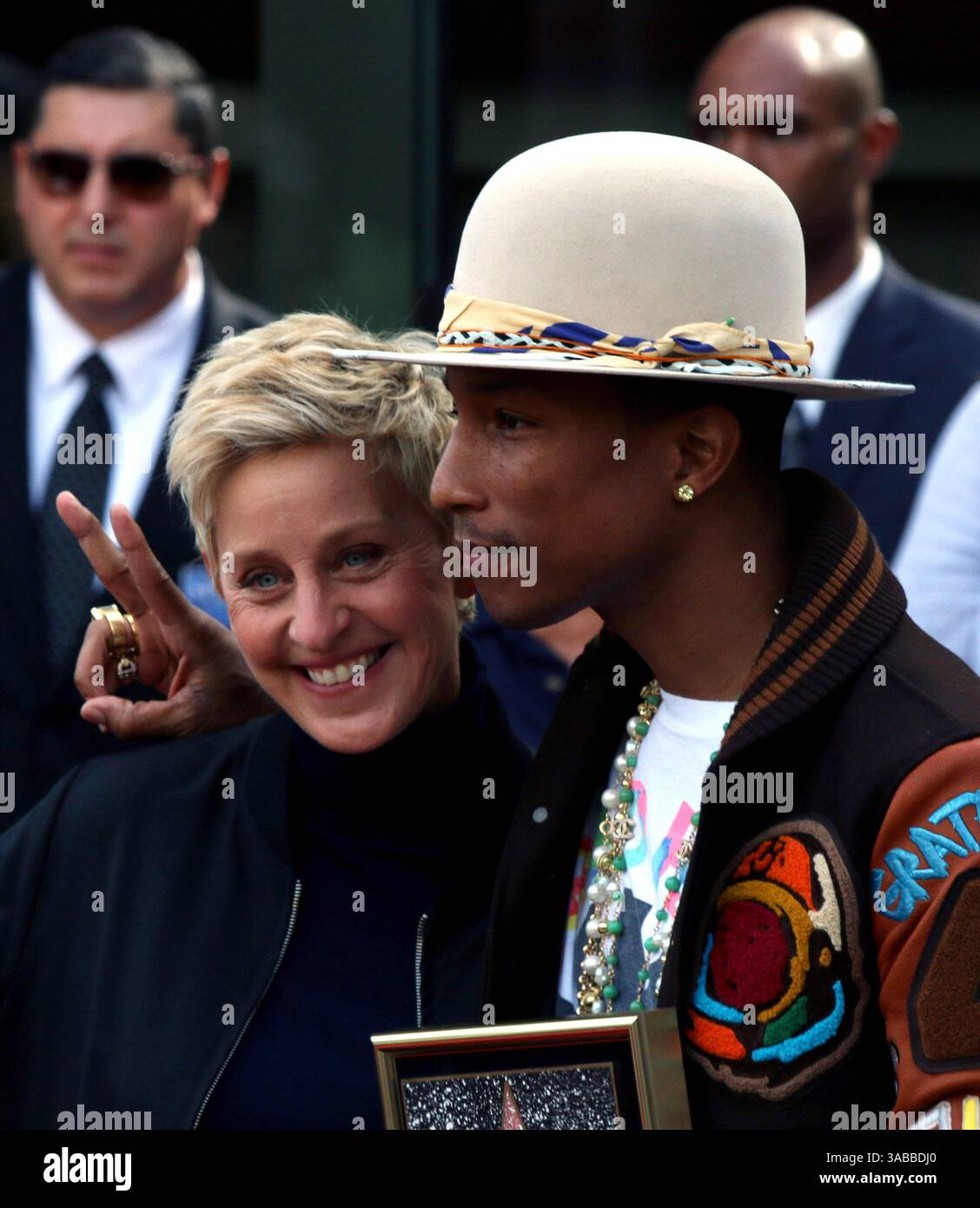 Ellen Degeneres and Pharrell Williams at a ceremony honoring Pharrell ...