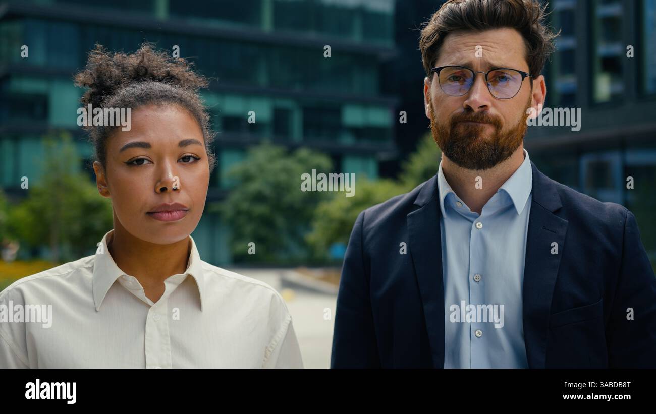 Two multiracial business colleagues African American woman female ...