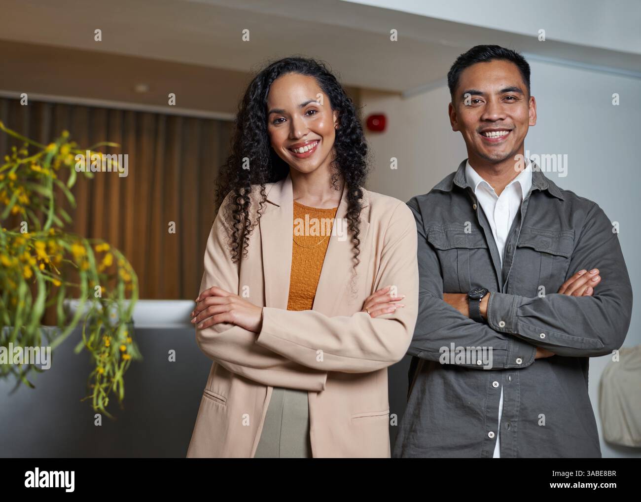 Confident Professionals Posing Together in a Modern Office Setting Stock Photo