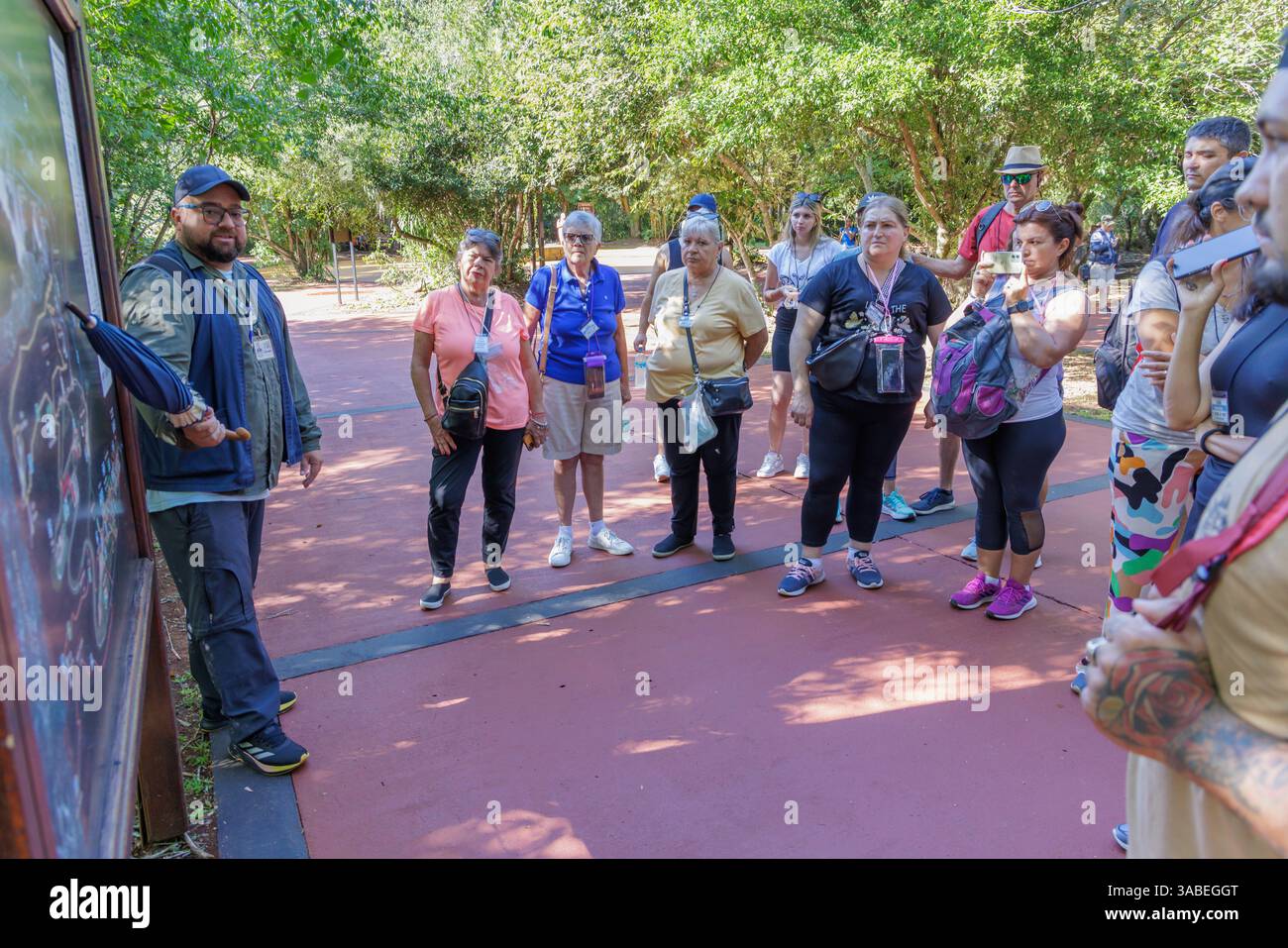 Puerto Iguazu, Misiones, Argentina - April 2nd, 2025: Tourists in Iguazu National Park. Stock Photo