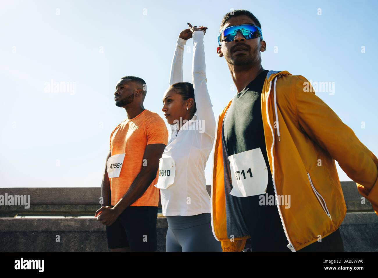 Pre race warm up stretching hi-res stock photography and images - Alamy