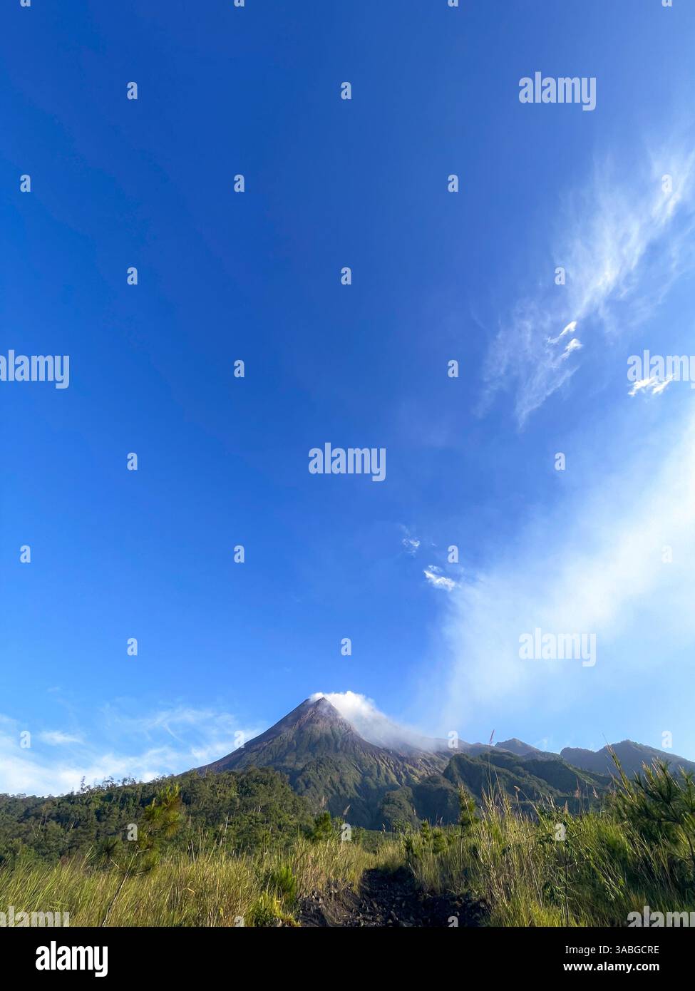 beautiful view of mount merapi against blue sky and white cloud - Smartphone Captured Stock Image