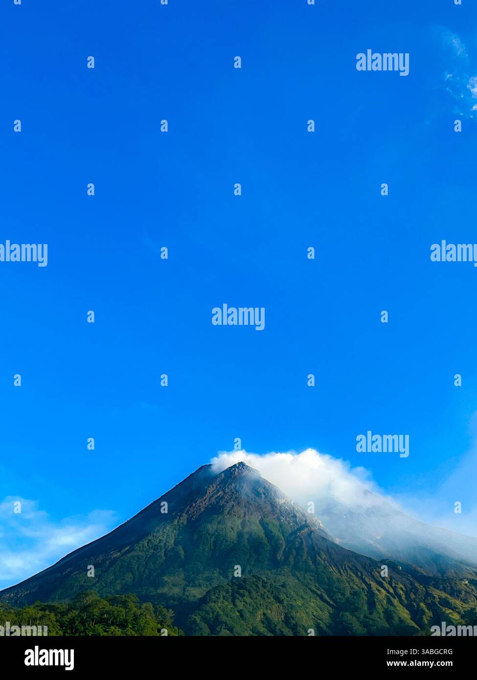 beautiful view of mount merapi against blue sky and white cloud - Smartphone Captured Stock Image