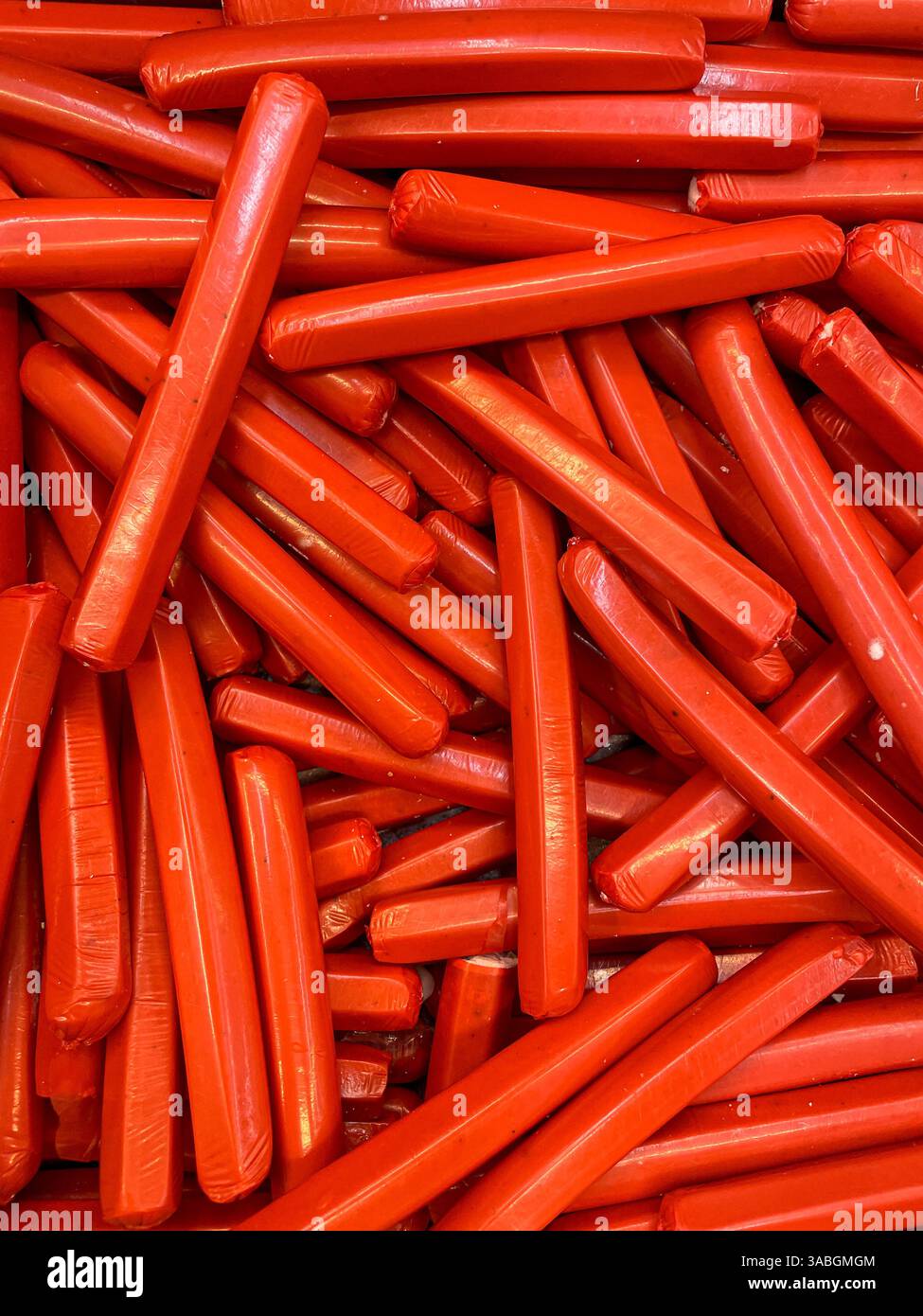 frozen beef sausages in freezer as food background - Smartphone Captured Stock Image