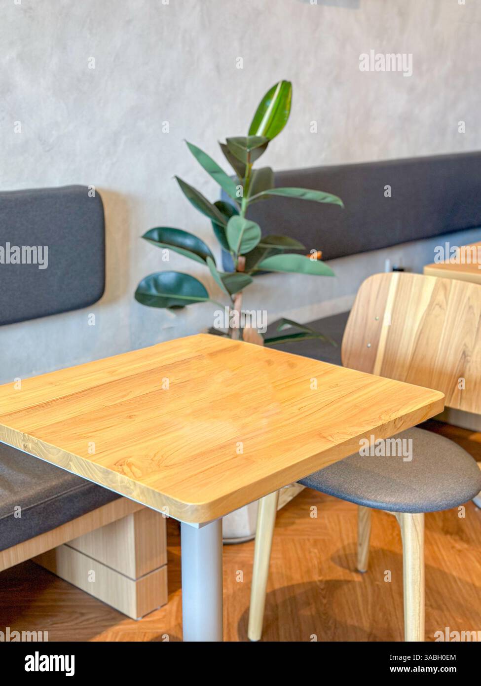 Empty wooden table with cafe or coffee shop background Ready to display products - Smartphone Captured Stock Image