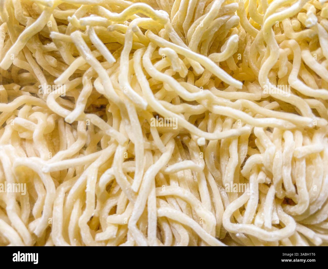 Close up view raw asian ramen noodle background texture - Smartphone Captured Stock Image