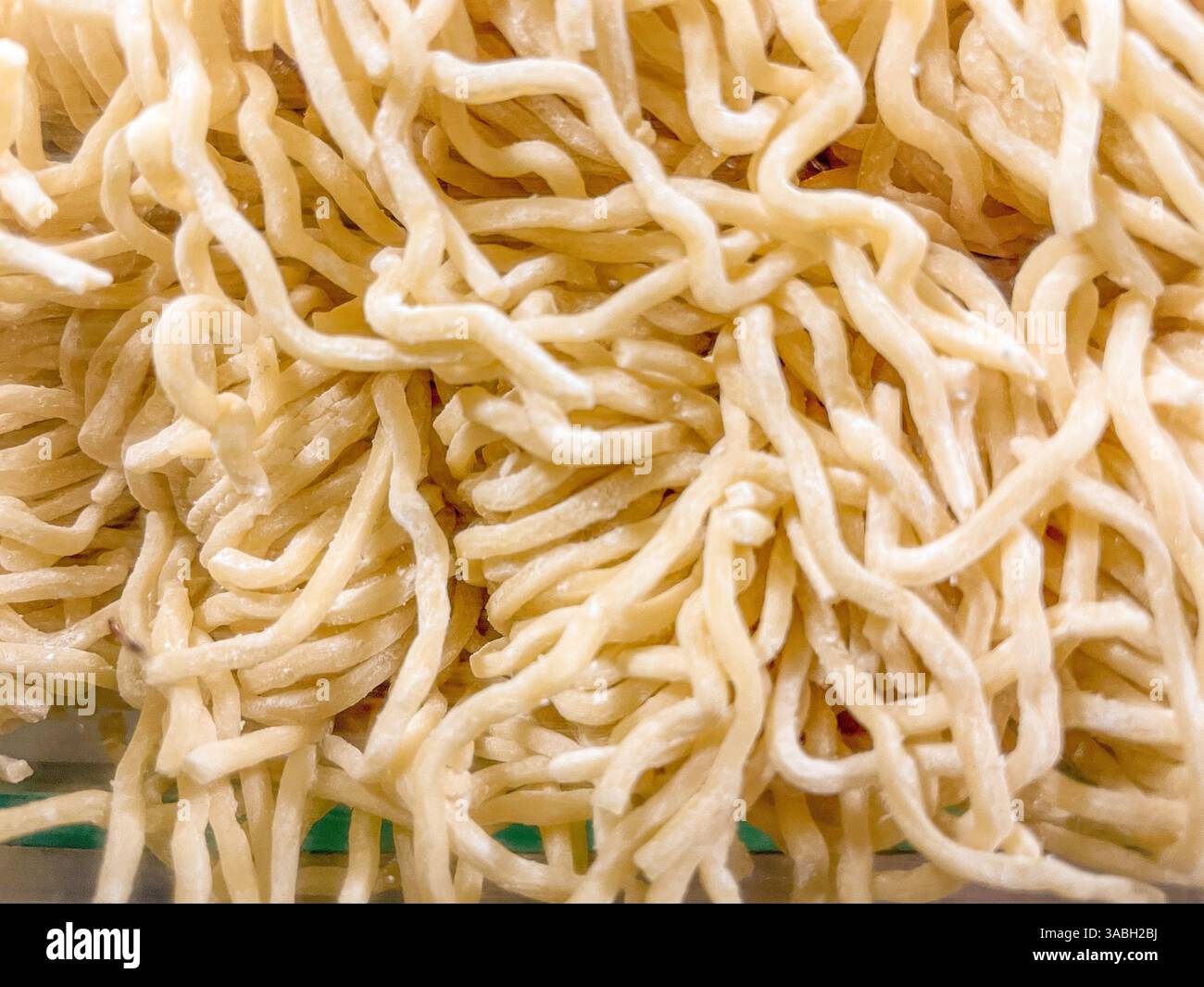 Close up view raw asian ramen noodle background texture - Smartphone Captured Stock Image