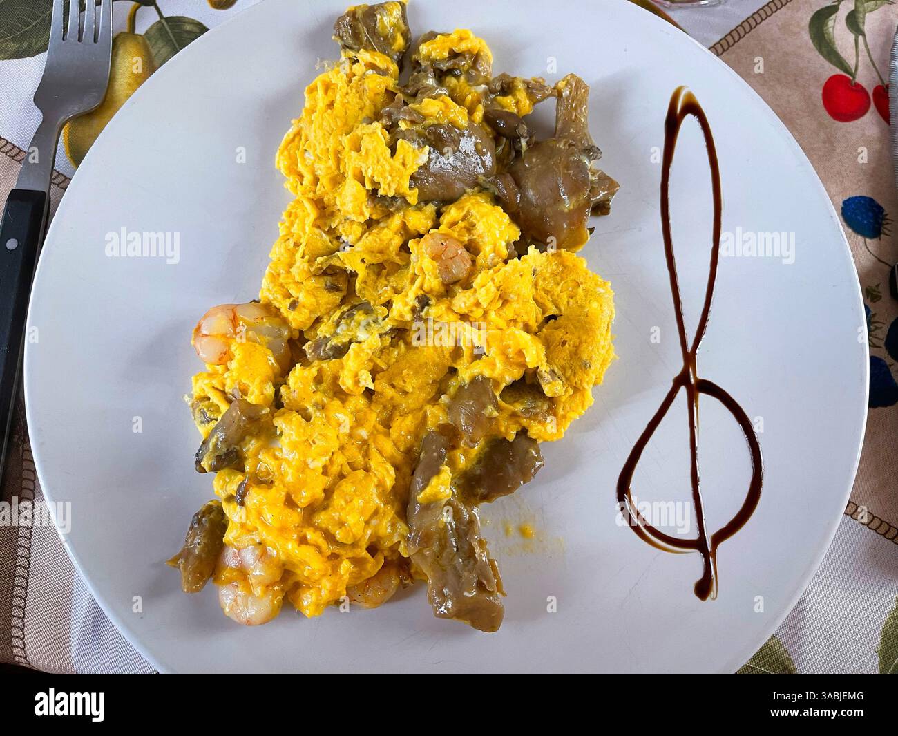 Scrambled eggs with prawns and mushrooms. Spain. - Smartphone Captured Stock Image