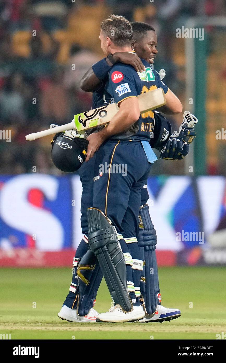 Gujarat Titans' Sherfane Rutherford, left, hugs batting partner Jos ...