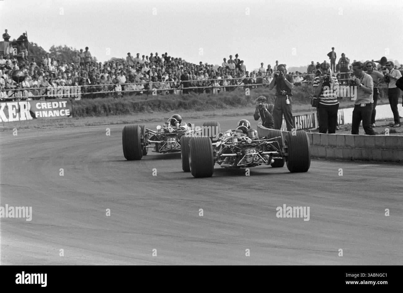 Race winner Jim Clark leads his Lotus team mate Graham Hill..British GP ...