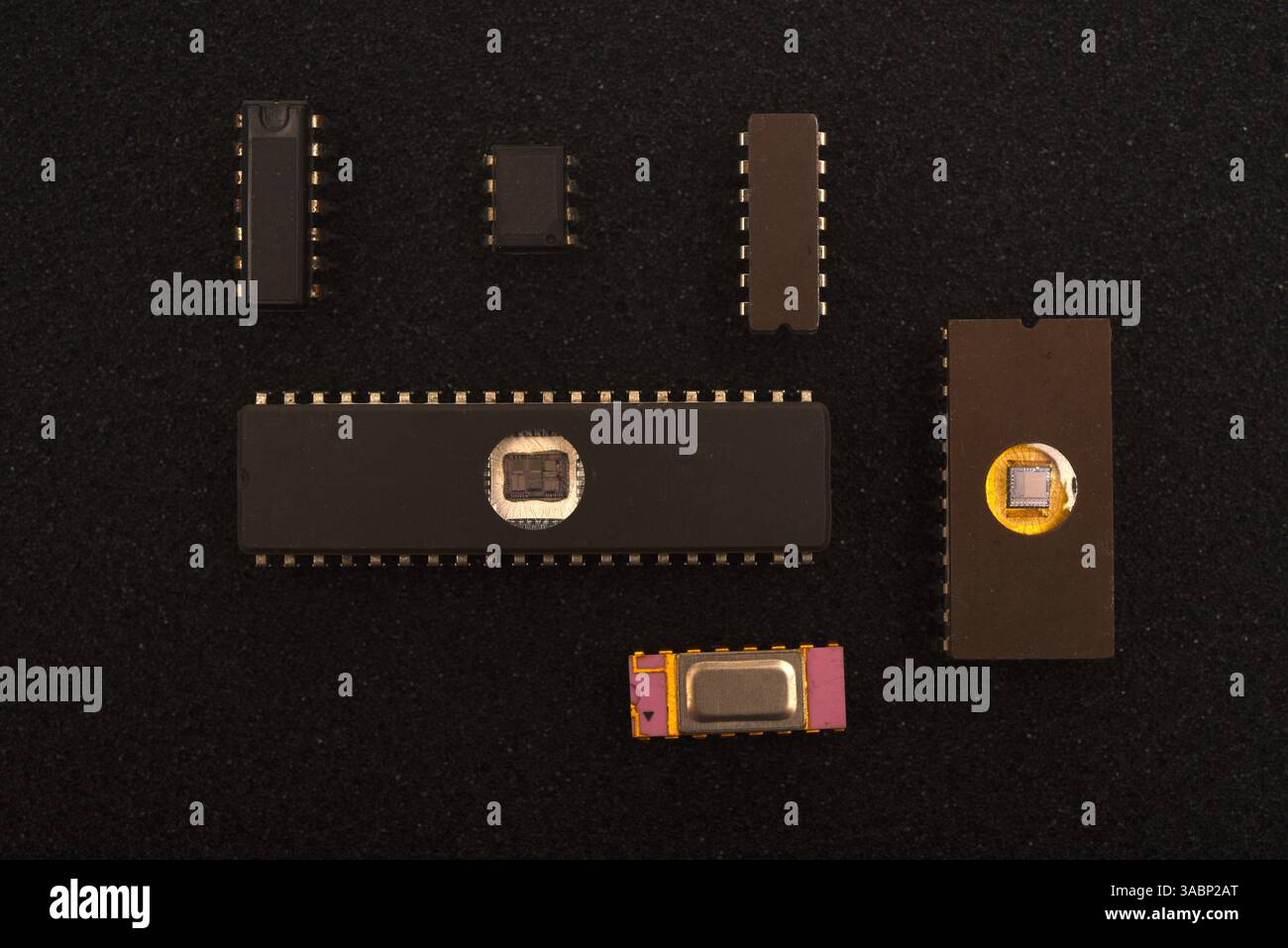 Several microchips on black foam. Old integrated circuits for radio electronics. Stock Photo