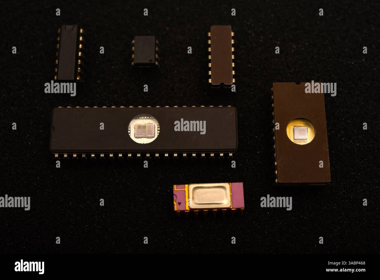 Several microchips on black foam. Old integrated circuits for radio electronics. Stock Photo