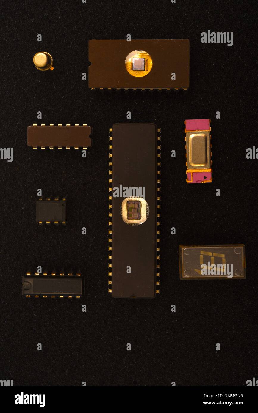 Several microchips on black foam. Old integrated circuits for radio electronics. Stock Photo