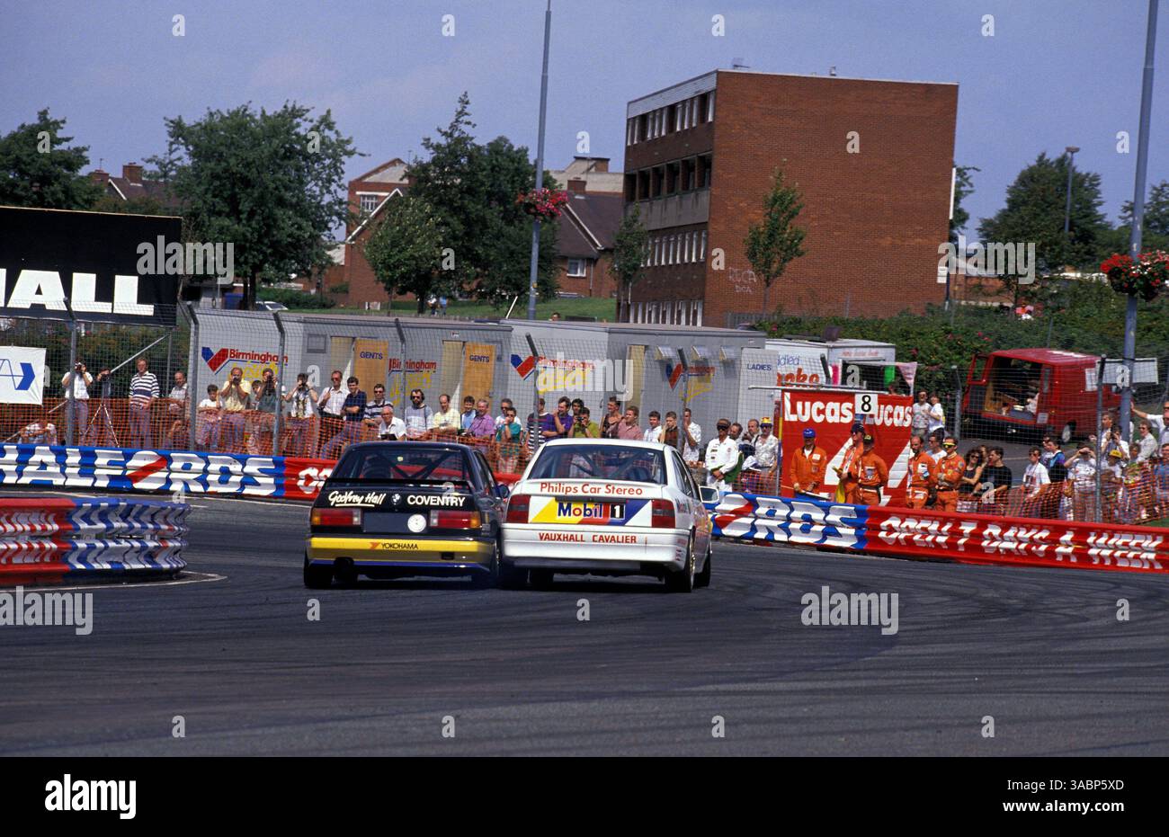 John Cleland (GBR) Vauxhall Cavalier GSi, passes Godfrey Hall (GBR) BMW ...