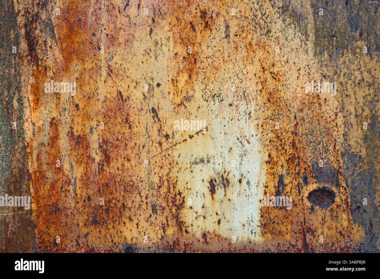 Rust forms an interesting pattern on a metal surface Stock Photo