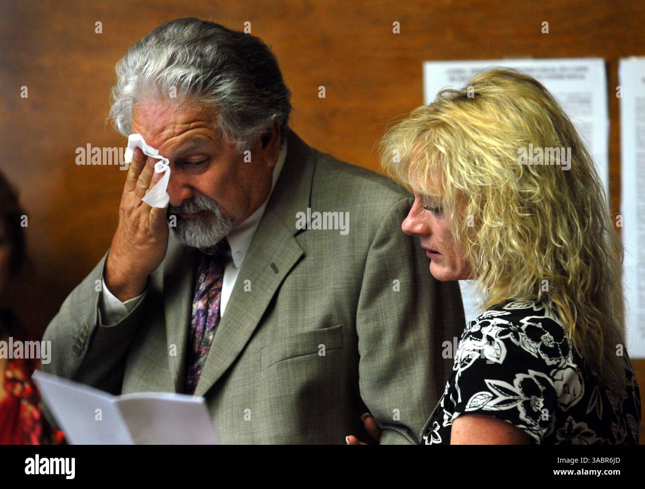Gordon Cromwell wipes away tears as his ex-wife Kathy McGinnis reads a letter that  they perpared to read during the parole hearing for Lori Nathan, the daycare provider who murdered their 11-month-old son, Matthew Cromwell, in the early 80's at her Clayton Calif. home. The hearing was the first parole hearing for Nathan after spending 25 years in prison  at The California Institution for Women in Corona Calif. The couple were the last to speak Thursday afternoon July 26, 2007, after a packed  room of over 35 people came to voice their concerns about Nathan being set free. Nathan was denied pa Stock Photo