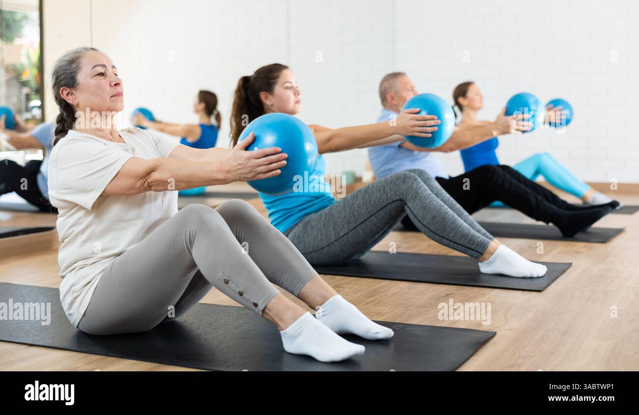 Elderly woman practicing pilates hi-res stock photography and images ...