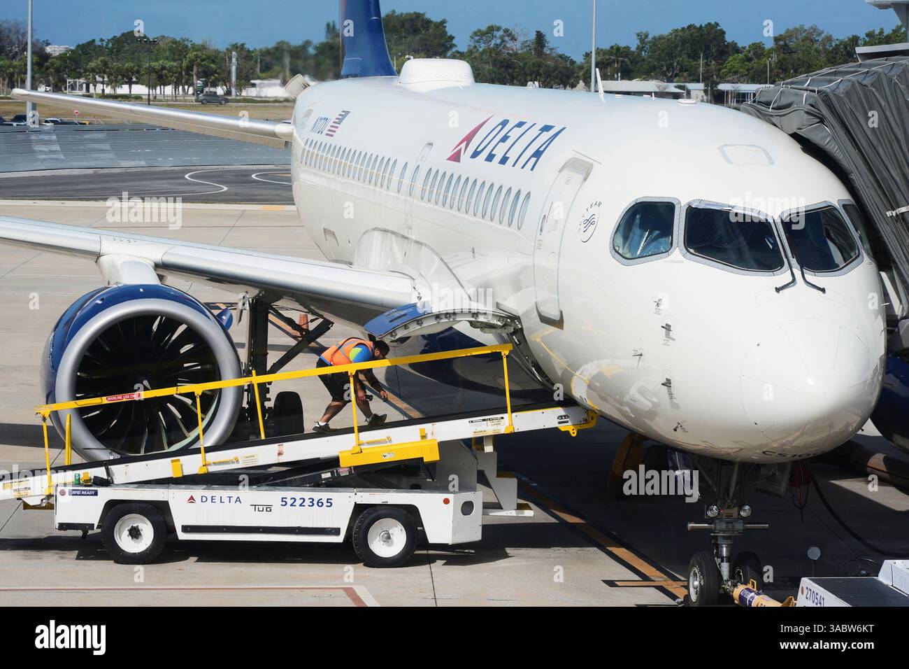 A Delta Airlines plane is serviced at Sarasota-Bradenton International ...