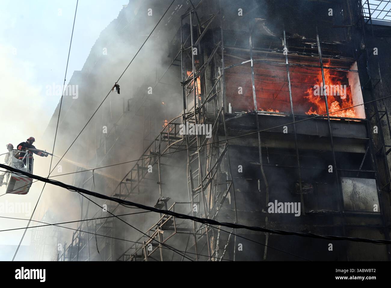 NEW DELHI, INDIA - APRIL 1: Firefighters try to douse a fire that broke ...