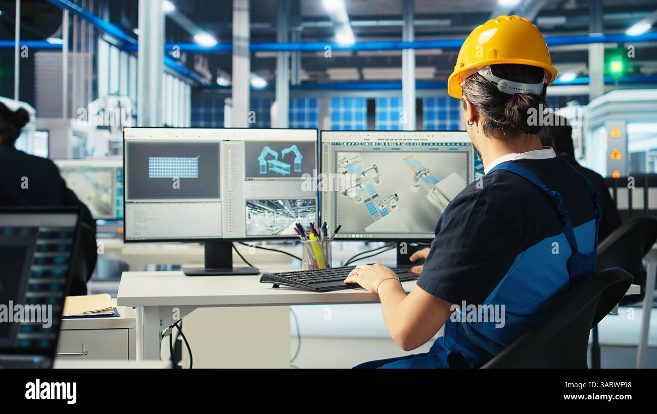 Photovoltaics factory engineer wearing hardhat planning work on ...