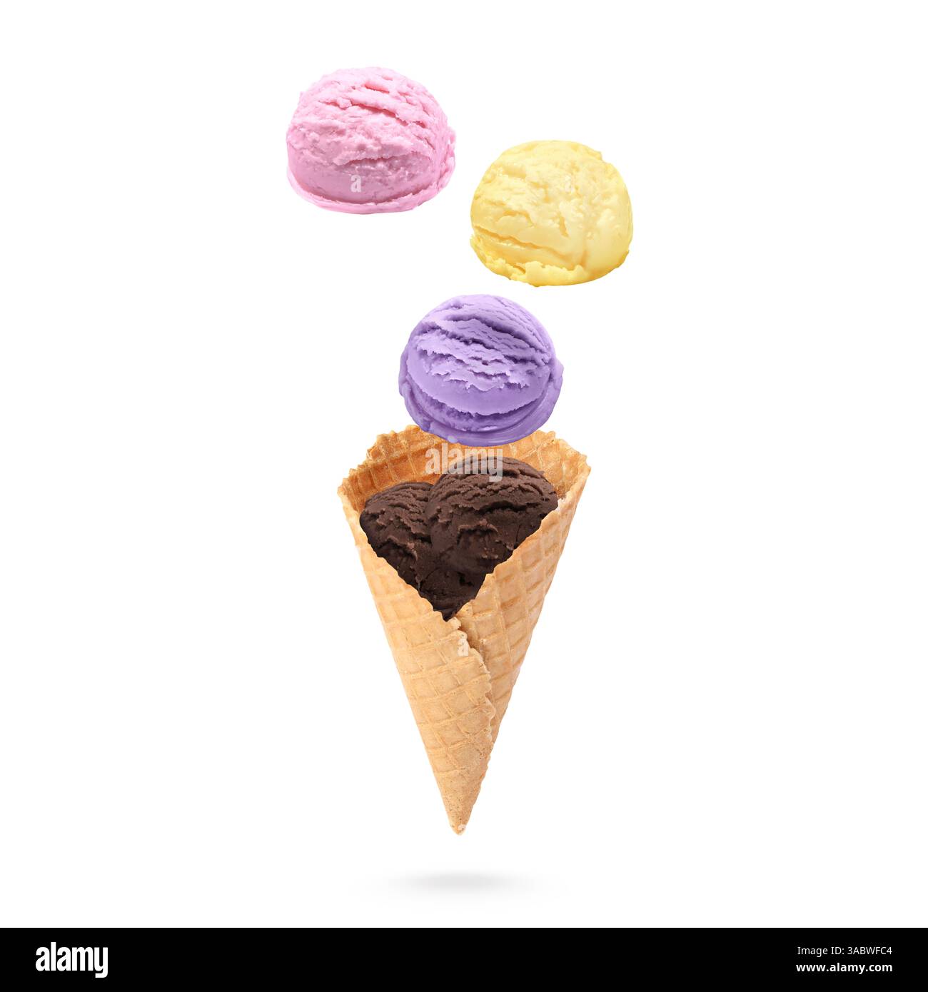 Ice cream scoops and waffle cone in air on white background Stock Photo ...