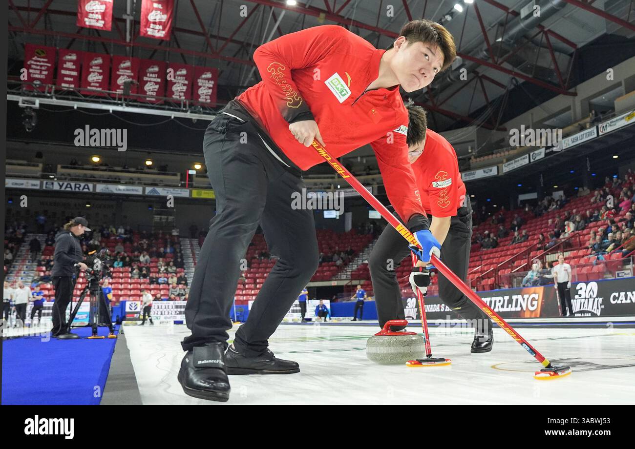 China's Zhiyu Wang (left) and Zhichao Li sweep a stone against Czechia ...