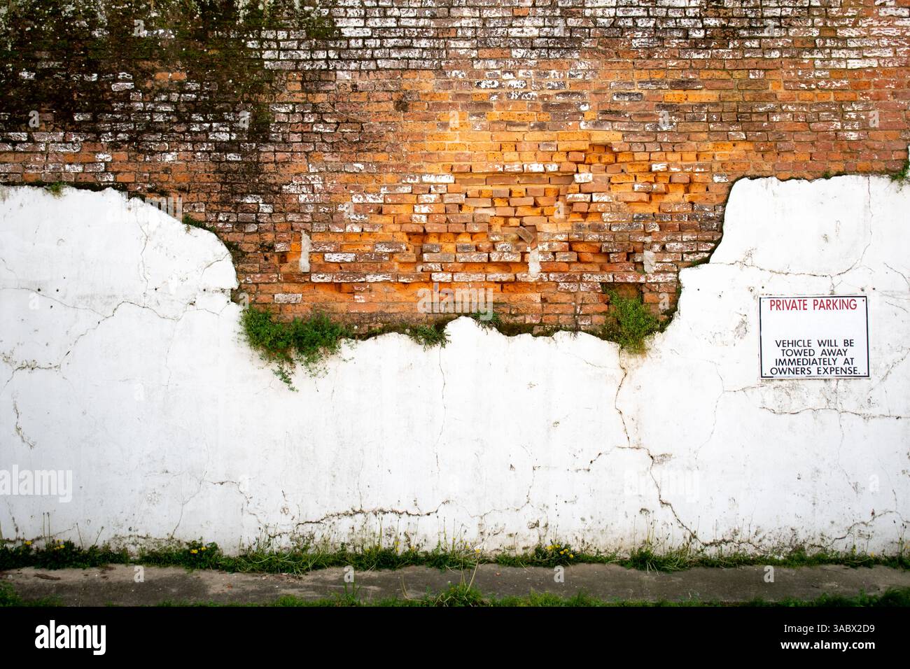 Private Parking sign on old brick wall Stock Photo