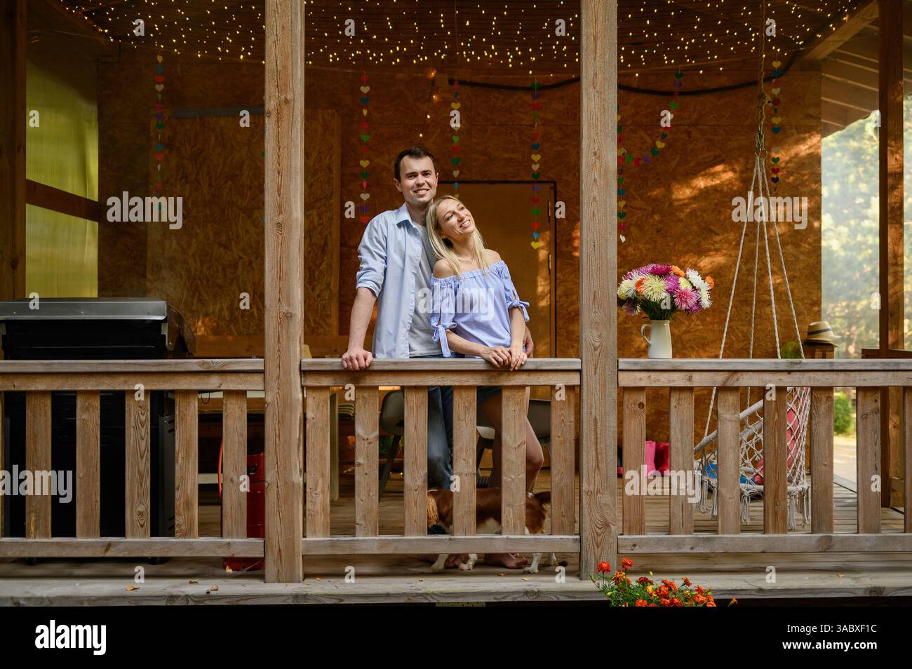 Happy family couple dog runs hi-res stock photography and images - Alamy