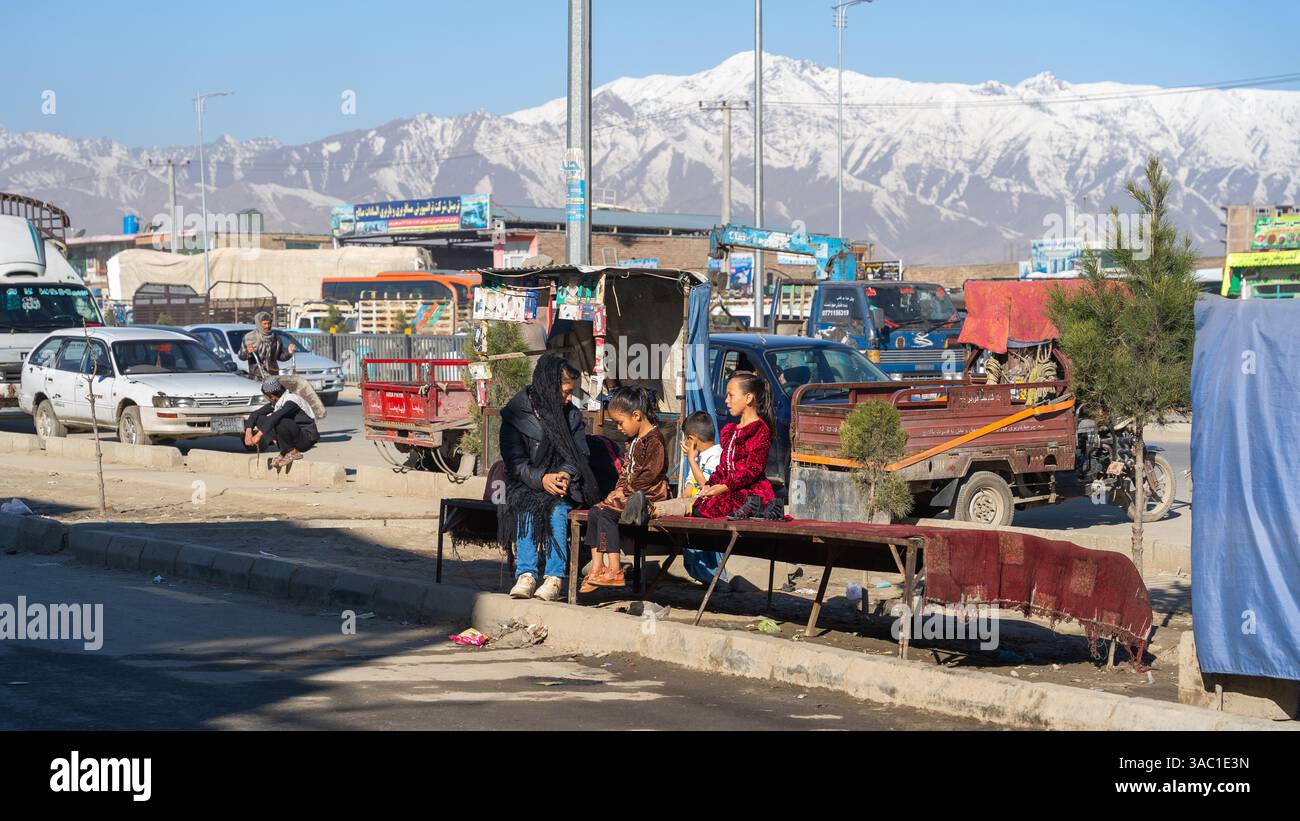 local-residents-of-kabul-near-the-kabul-kandahar-highway-stock-photo