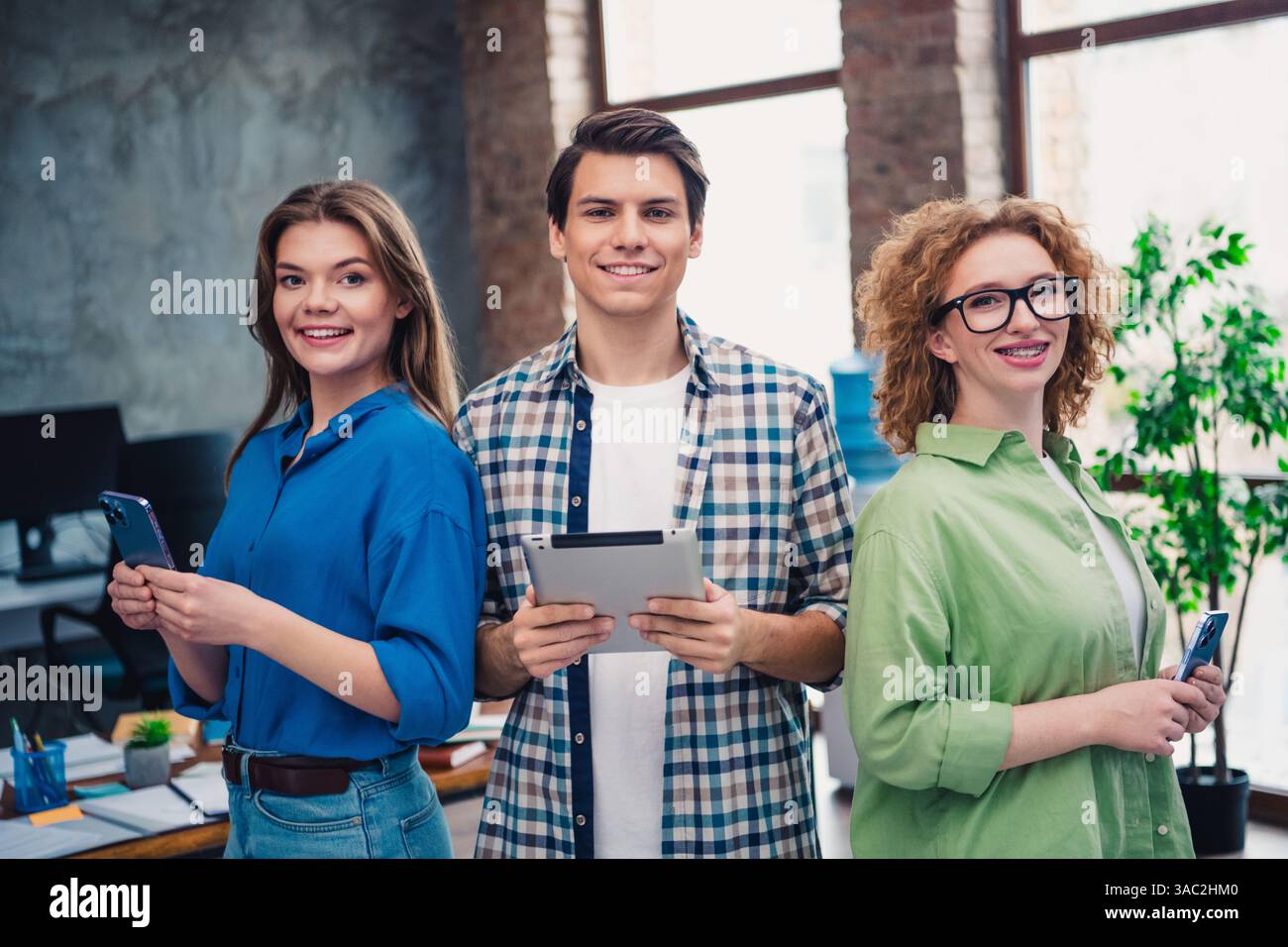 Group of young professionals collaborating in a modern office setting ...