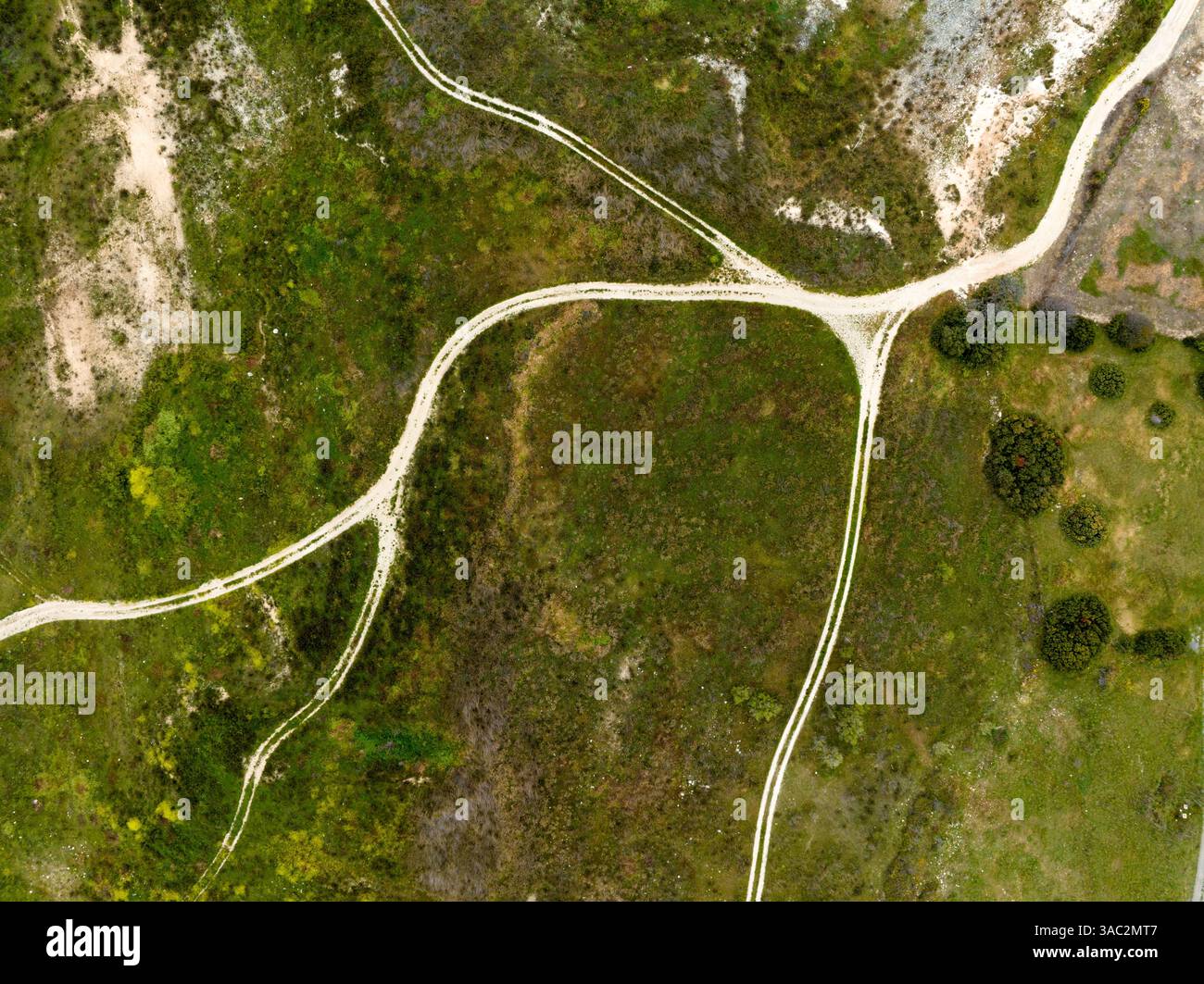 An aerial view of country roads in a green field Stock Photo - Alamy
