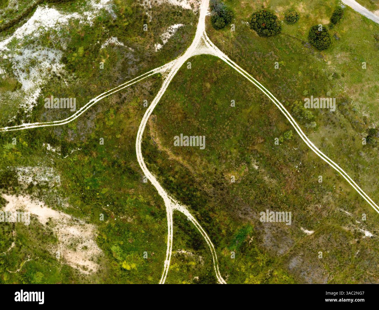 An aerial view of country roads in a green field Stock Photo - Alamy