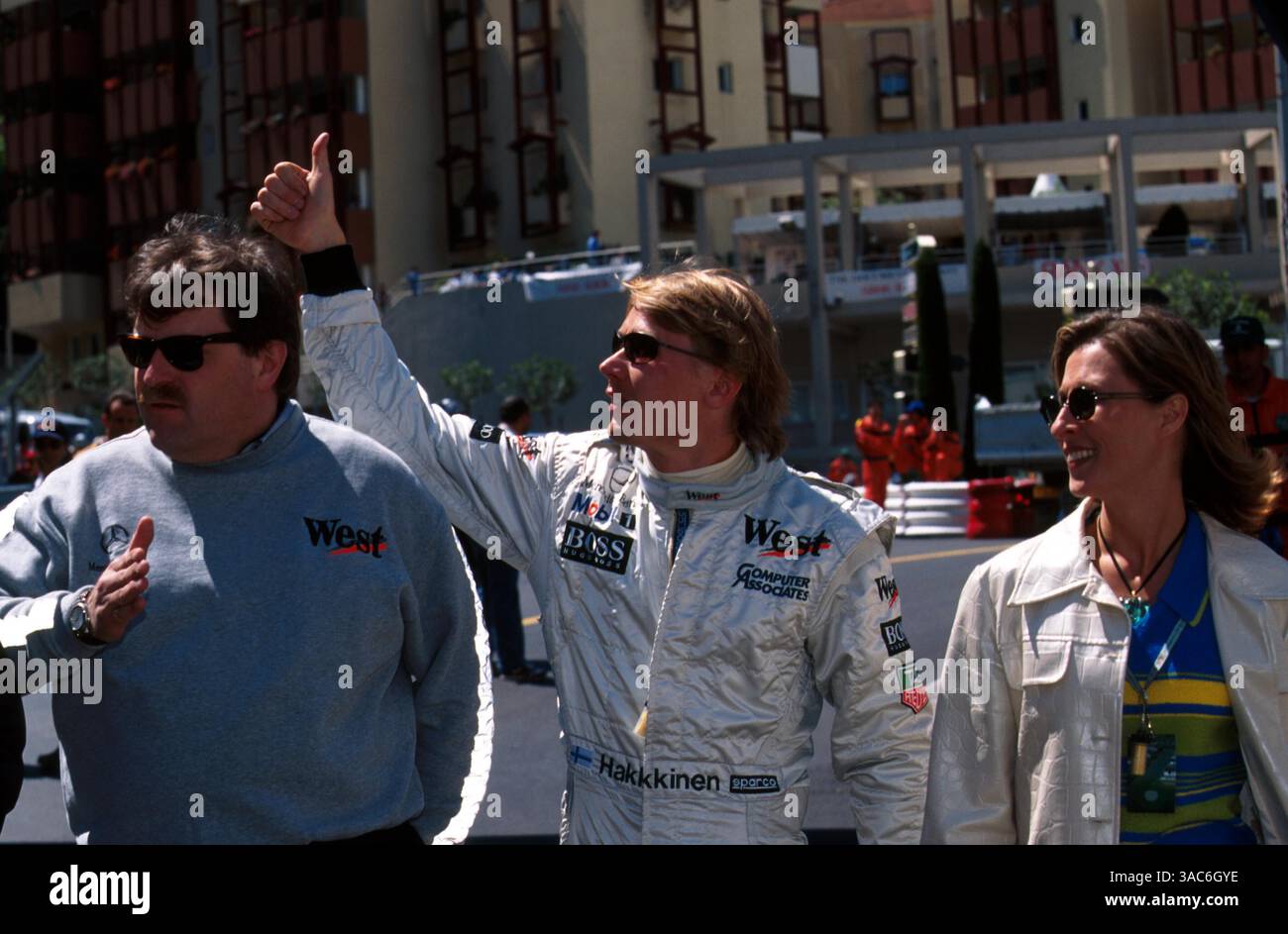 Norbert Haug (GER) Mercedes Boss with Mika Hakkinen (FIN) and wife Erja ...