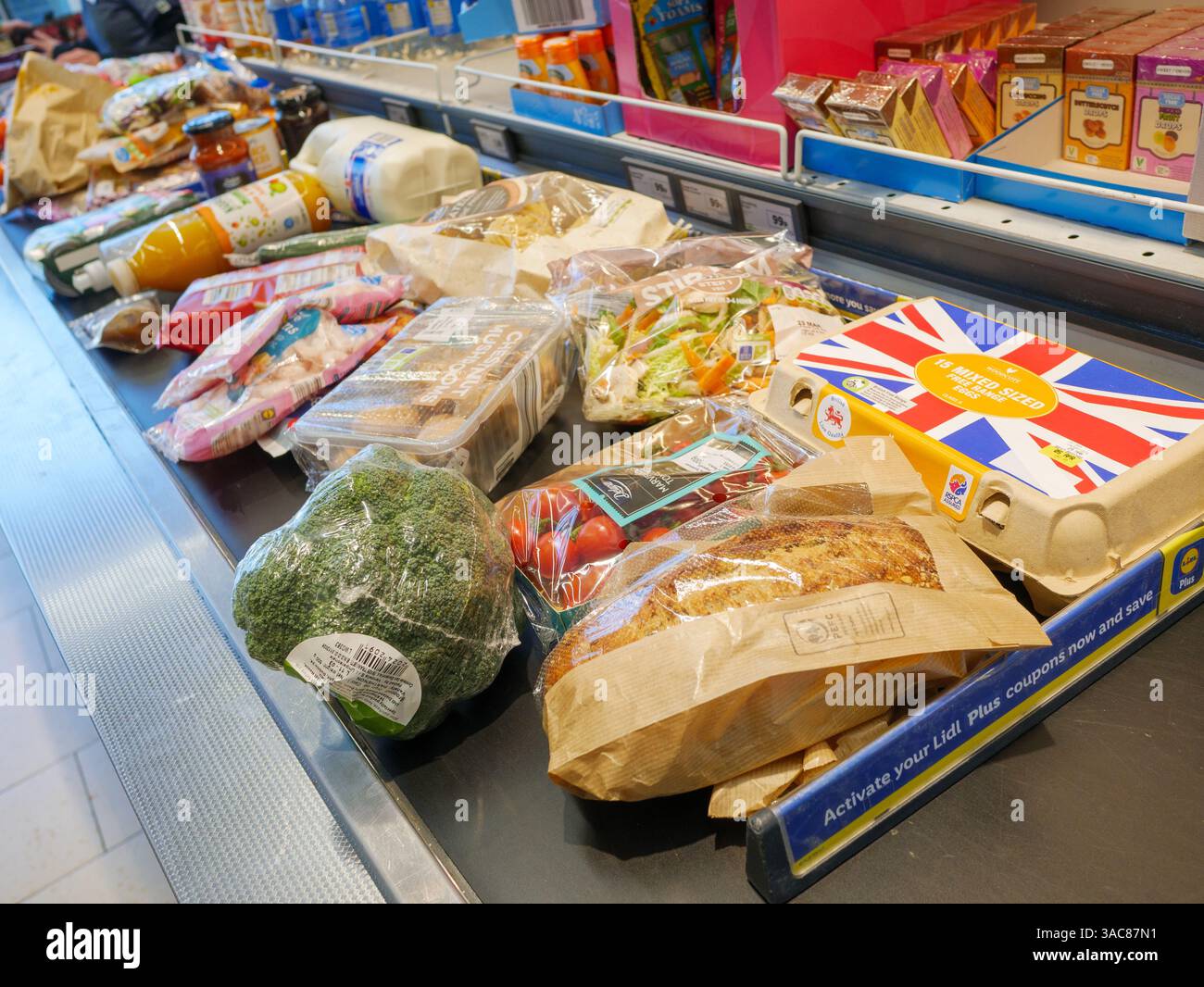 Photo inspiration: Fresh Look at Grocery Food Shopping On Conveyor Belt At Supermarket Checkout Till