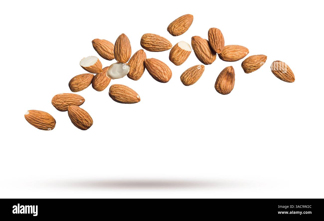 Shelled almonds floating isolated on white background. Stock Photo