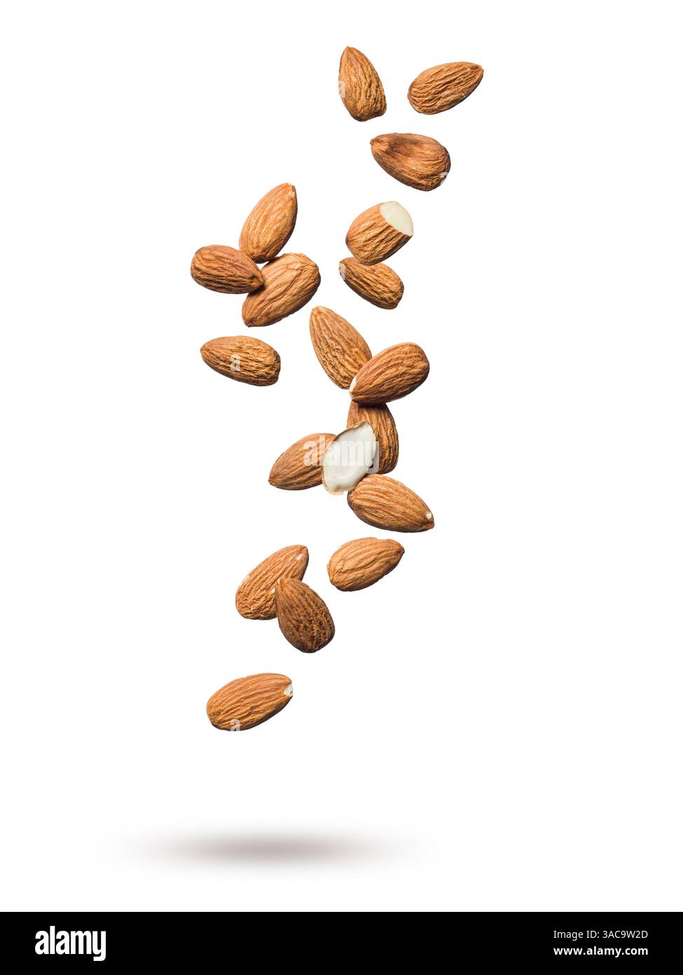 Shelled almonds floating isolated on white background. Stock Photo